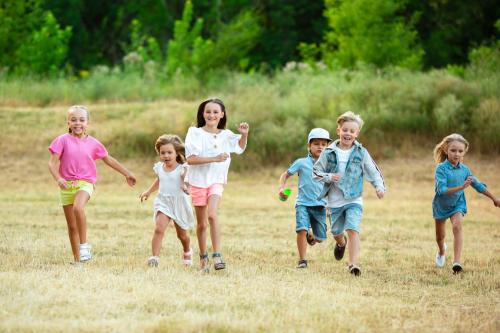 kids-children-running-meadow-summertime